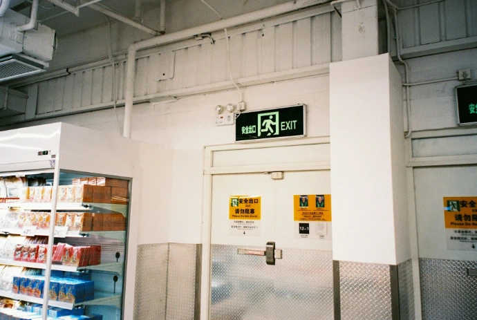 a white refrigerator freezer sitting inside of a store